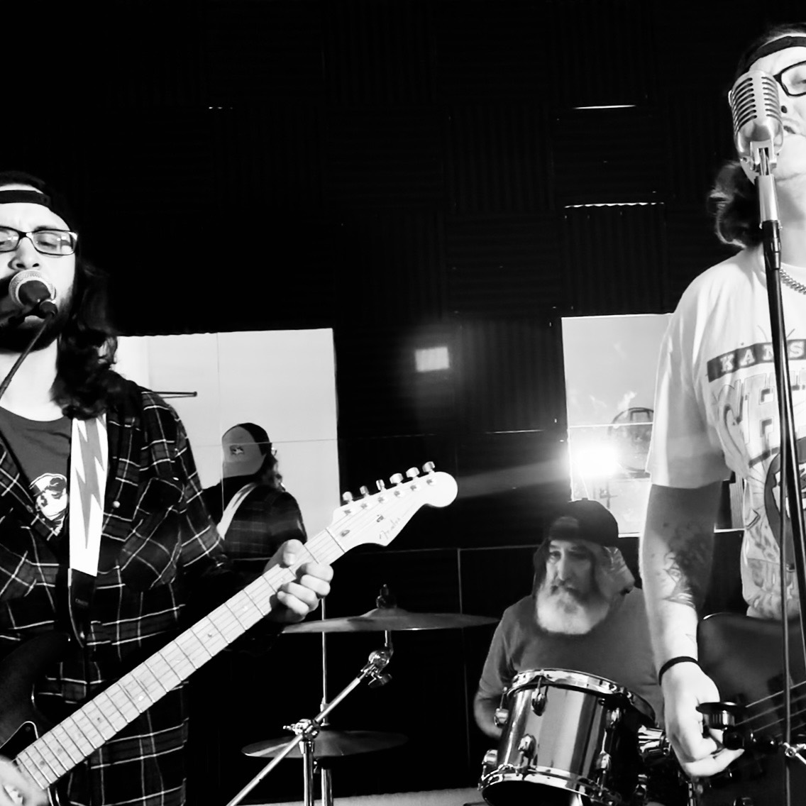 SUSAF rehearsing together in black and white