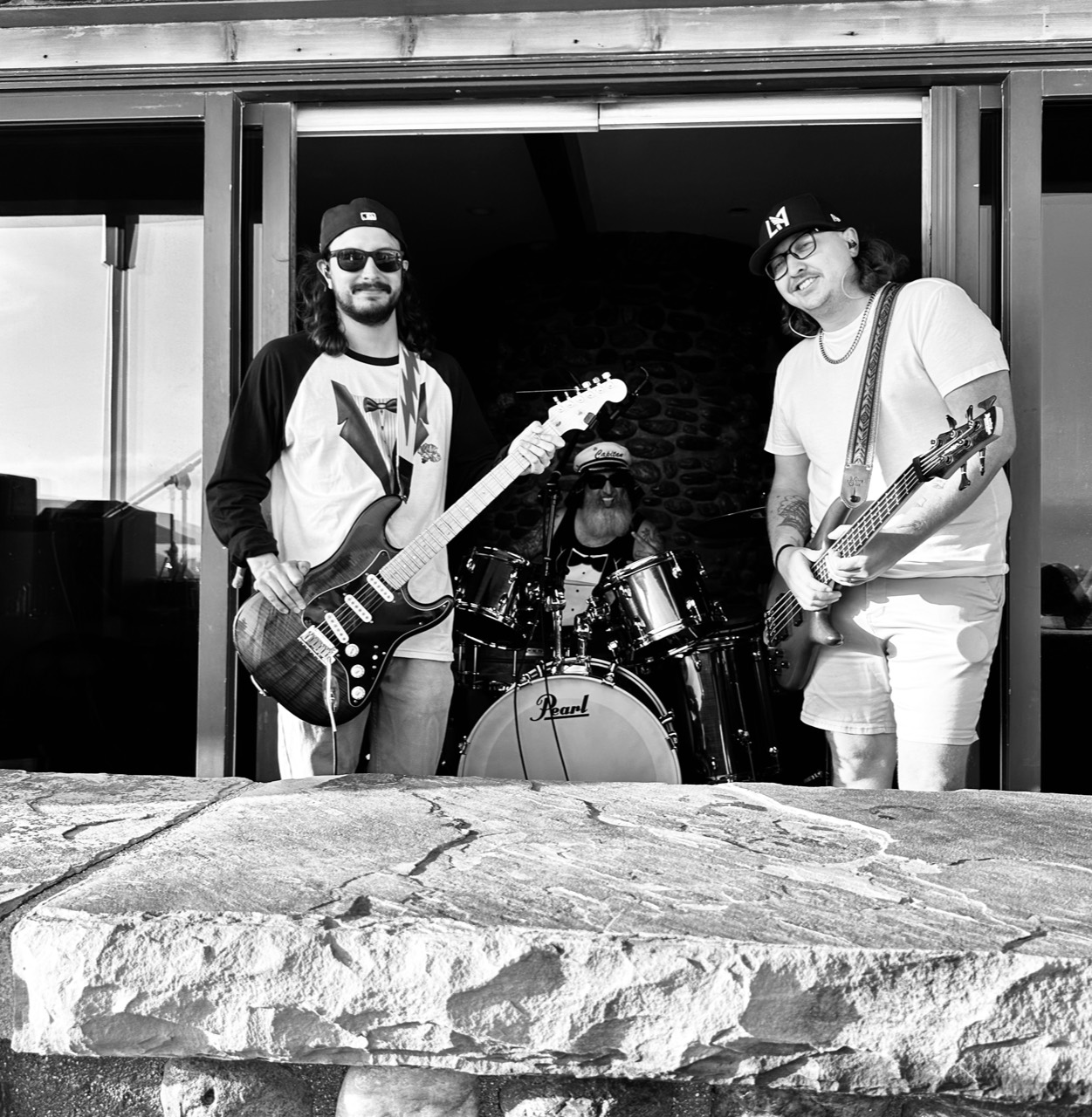 SUSAF performing together with guitar, drums, and bass